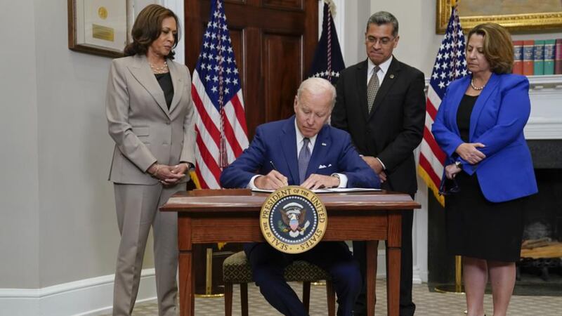 President Joe Biden signs an executive order on abortion access during an event in the...