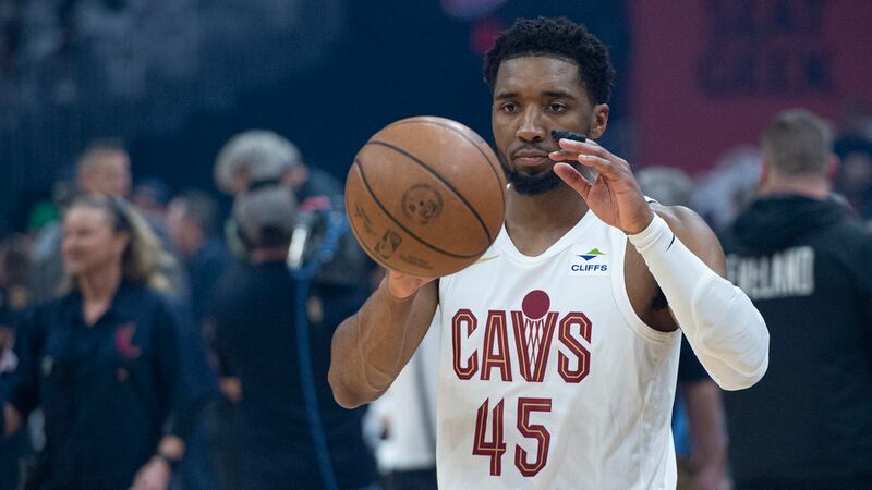 Cleveland Cavaliers' Donovan Mitchell (45) warms up before the start of Game 5 of an NBA...