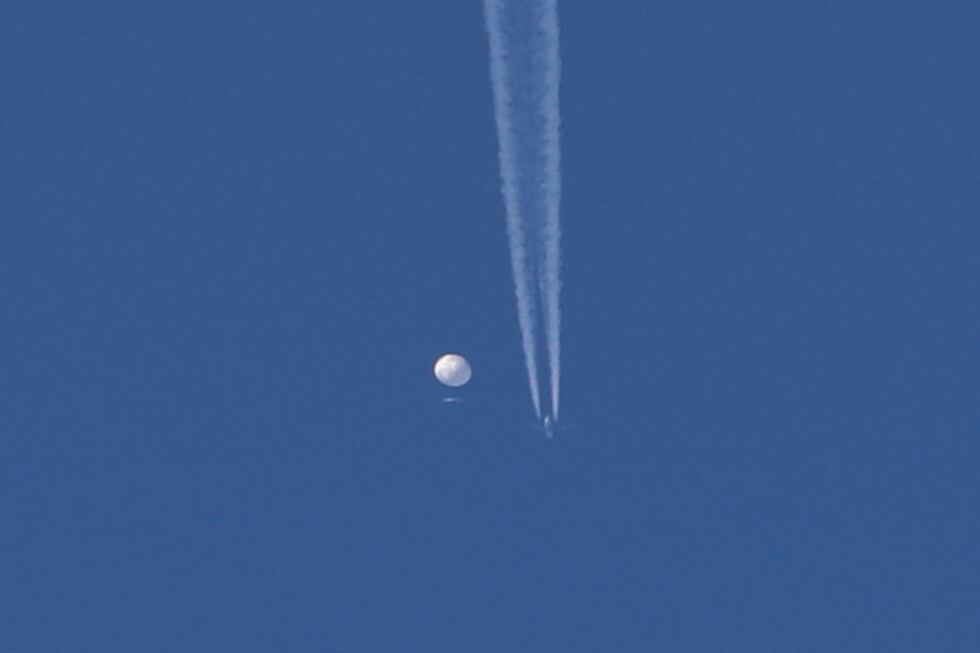 In this photo provided by Brian Branch, a large balloon drifts above the Kingstown, N.C. area,...