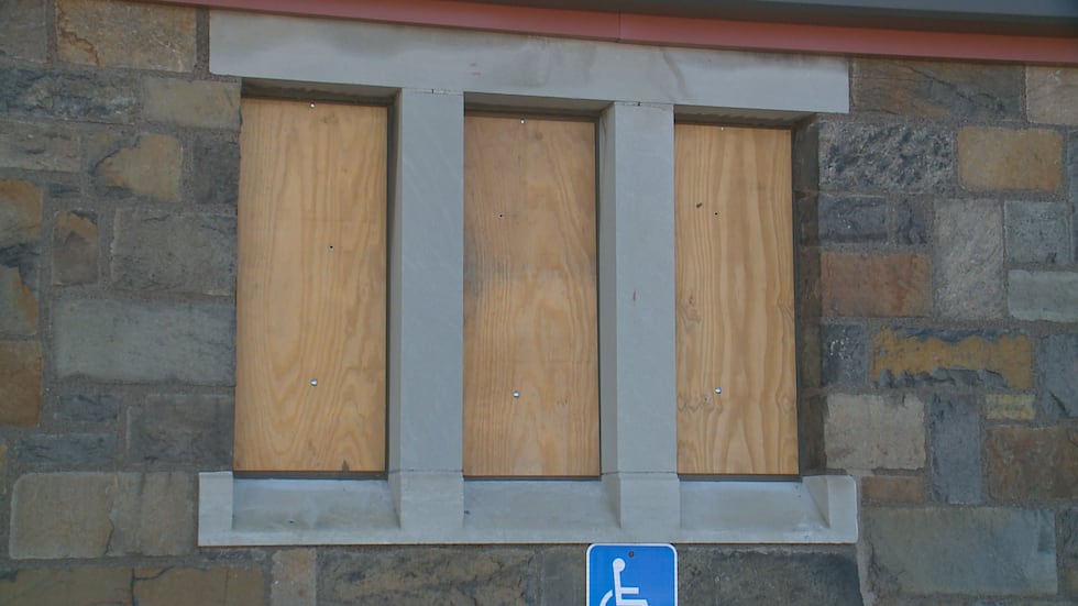 Police records say an unknown suspect threw rocks through seven stained glass windows and...
