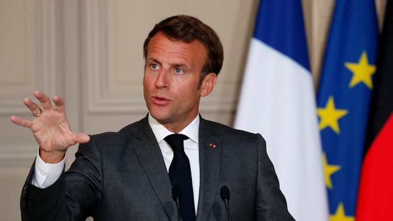 French President Emmanuel Macron speaks during a joint video press conference with German...