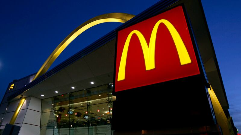 FILE - The McDonald's restaurant logo and golden arch is lit up, April 20, 2006, in Chicago....