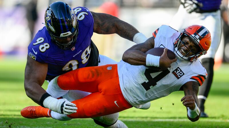 Cleveland Browns quarterback Deshaun Watson is tackled by Baltimore Ravens defensive tackle...