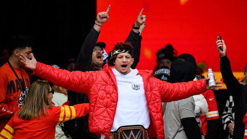 File - Kansas City Chiefs Patrick Mahomes, wearing a WWE belt, celebrates the team's Super...